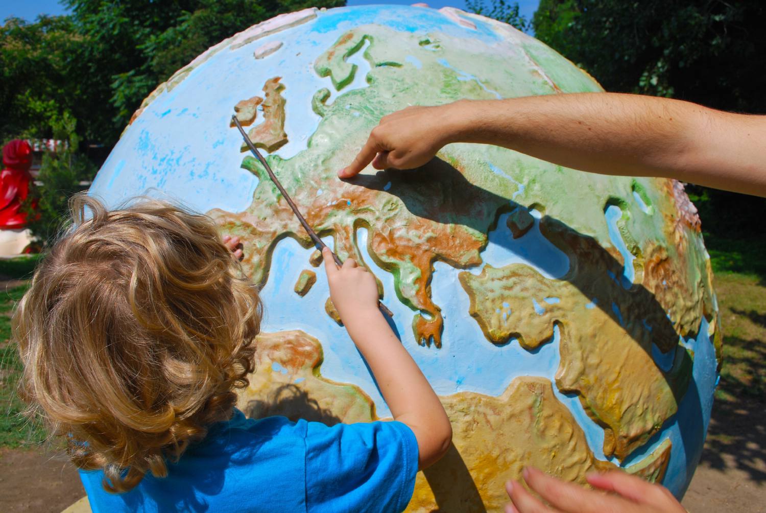 Pointing at germany on a globe